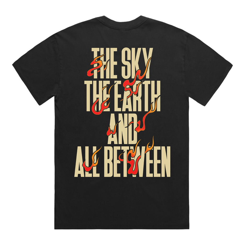 Black t-shirt with fiery text design reading ‘The Sky, The Earth and All Between’.