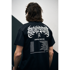 Man wearing a black short-sleeve t-Shirt with Architects European 2026 Tour dates printed across the back
